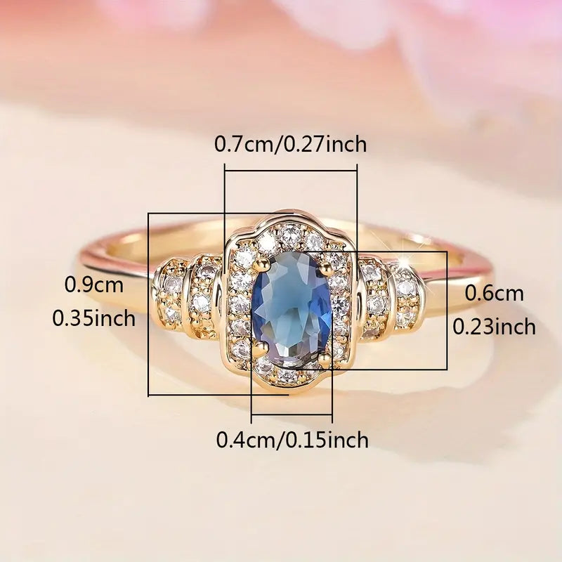 18K gold-plated promise ring with a blue gemstone, featuring detailed measurements in centimeters and inches.