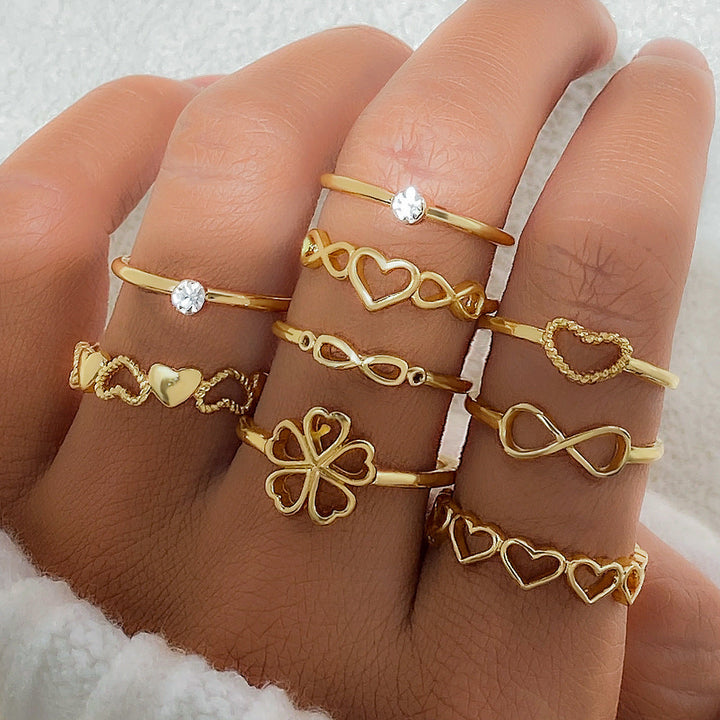 Elegance Meets Versatility: 9-Piece Gold Heart Rings Set