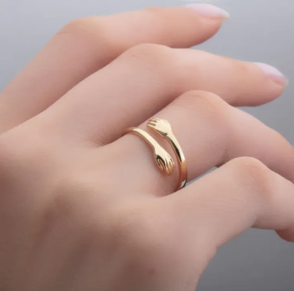 Unity Embrace: Hand-Clasping Rings